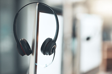 Image showing Call center, headset and computer in empty office for customer service business with technology. Telemarketing job, headphones and microphone on monitor at help desk for crm, networking and support.