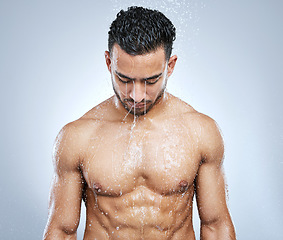 Image showing Man in shower with water, cleaning and body hygiene with fresh wellness, healthy clean and studio backdrop. Cleansing, skin and hair care, male model washing with skincare on background bathroom spa.