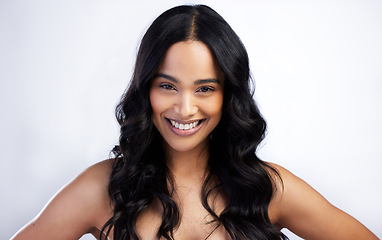 Image showing Beauty, face smile and curly hair of woman in studio isolated on a white background for skincare. Portrait, haircare and female model in natural makeup, cosmetics and salon treatment for hairstyle.