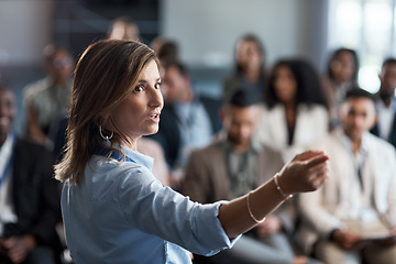 Image showing Presentation, training and coaching with a business woman talking to an audience during a workshop. Convention, speech and teaching with a female speaker giving a seminar to a group of employees