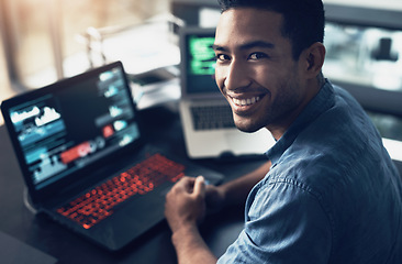 Image showing Portrait, man and smile of programmer on computer in office workplace at night. IT, face and male coder or person programming, coding and writing for software development or information technology.