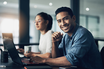 Image showing Man, portrait and happy programmer on laptop in office for deadline at night. IT, face and male coder programming, coding or writing for software development or information technology with coworker.