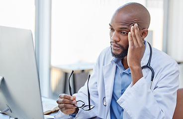 Image showing Stress, black man and doctor with a headache, frustrated or burnout with a computer error, glitch or health issue. Male person, employee or medical professional with a migraine, technology or anxiety