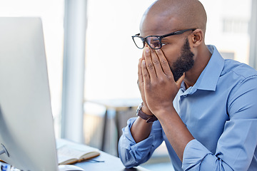 Image showing Mental health, businessman with stress and with computer at his desk of his office workplace. Anxiety or depressed, problem or mistake and burnout male person at his pc at his modern workspace