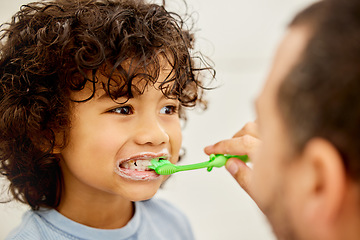 Image showing Child, brushing teeth and father helping in a bathroom with dental health and cleaning. Morning routine, toothbrush and kid with dad together showing hygiene care of mouth at home with grooming