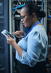 Image showing IT woman, engineer and tablet in a server room for programming, cybersecurity or maintenance. Black female technician in datacenter for network, software or system upgrade app with technology