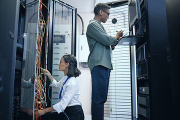 Image showing Server room, engineer and IT team with a tablet for programming, cybersecurity or cable maintenance. Man and woman technician together in datacenter for network, software or system upgrade with tech