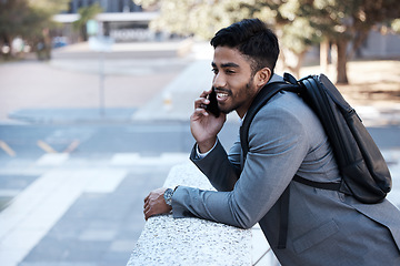 Image showing Business man, backpack and phone call in street, city or smile with vision, networking or listen. Young indian businessman, outdoor and walk with smartphone, talk and professional in metro for travel