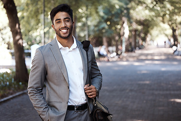 Image showing Portrait, business and happy man in city for travel, morning commute or urban journey outdoor. Corporate male employee, entrepreneur and confident in street with pride, professional commitment or bag