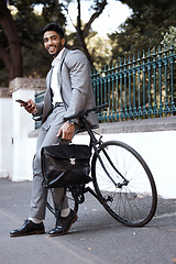 Image showing Bicycle, portrait and business man with phone in a city for texting, social media and cycling break. Bike, commute and male person with smartphone in a street for location, search and GPS navigation