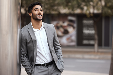 Image showing Thinking, happy and a businessman in the city on a wall for ideas, planning and a vision. Smile, corporate and a man in a suit in town for ideas, a plan or professional happiness for business