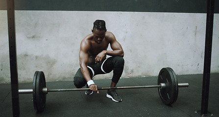 Image showing Weightlifting, bodybuilder and black man with barbell in gym for training, exercise and strong workout. Fitness, muscles and male person lifting weights for challenge, wellness and body strength