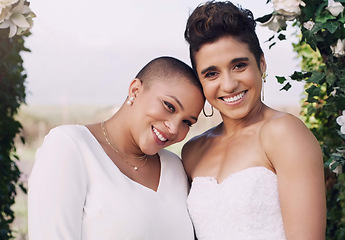 Image showing Wedding, happiness and portrait of lesbian couple with smile, love and diversity in flower arch. Lgbt marriage, celebration and happy face of woman with bride at reception, lgbtq pride and commitment