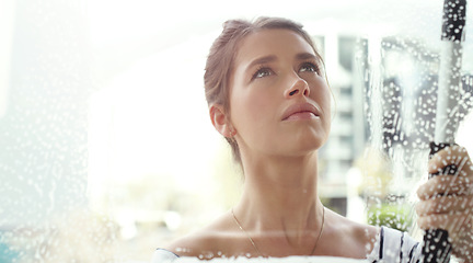 Image showing Woman, face and window cleaning with soap and detergent, chemical liquid and housekeeping with focus. Female cleaner with foam, clean glass and disinfectant with hygiene, housekeeper and mockup space