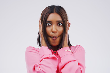 Image showing Portrait, funny face and lips with an indian woman in studio on white background looking silly or goofy. Comedy, comic or crazy with a fun young female person sucking cheeks indoor for playful humor