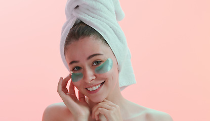 Image showing Portrait, woman and skincare with eye mask in studio happy with beauty, collagen and anti aging on pink background. Face, patches and female model with skin cosmetics, facial and vitamin c treatment