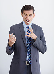 Image showing Fail, phone call and business man angry, annoyed and screaming in studio on white background. Stress, anger and male person annoyed with phishing, delay and conversation with bad connection problem