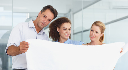 Image showing Business people, blueprint and planning in teamwork for construction, meeting or collaboration at office. Group or architect team looking at document, paperwork or floor plan for architecture project