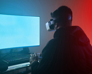 Image showing Man, computer with green screen, virtual reality and gaming, online streaming metaverse and mockup space. Digital world, VR goggles and controller, future technology and male streamer in dark room