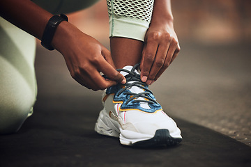 Image showing Lace, gym or hands of person with shoes at gym for training, exercise or workout motivation in fitness center. Tie, closeup or legs of girl sports athlete with footwear ready to start exercising