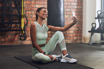 Image showing Gym, fitness or happy woman taking selfie on workout, exercise or training break for social media. Wellness, smile or healthy Indian girl smiling, relaxing or taking pictures for online post