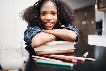 Image showing Child, school books and happy for education, learning and development at a table in a house. Face portrait of an african girl kid or student with a smile, knowledge and happiness while studying