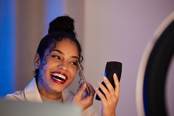 Image showing Influencer woman, ring light and eyeshadow with smile, cosmetics or beauty on live stream, broadcast or web video. Girl, review or online entrepreneur with happiness, mirror and comic on social media