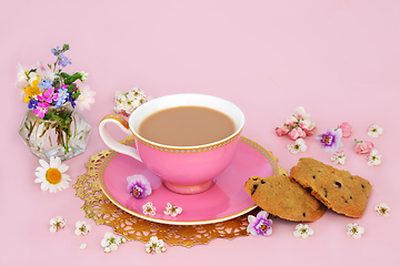 Image showing Chocolate Chip Cookies Tea Cup and Spring Flower Arrangement 