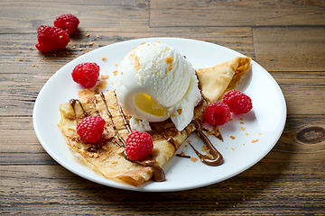 Image showing freshly baked crepe with ice cream