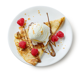 Image showing plate of crepe with ice cream and raspberries