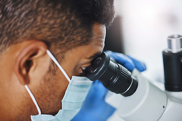 Image showing Science, laboratory and man looking in microscope for research, medical analysis and lab test. Healthcare, biotechnology and male scientist with equipment for virus sample, experiment and examine