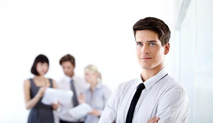 Image showing Portrait, business and man with confidence, management skills and entrepreneur in the workplace. Face, male person and employee with arms crossed, leadership and startup with consultant and worker