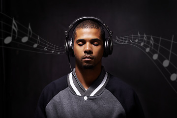 Image showing Overlay, music and notes with a man streaming audio in studio on a dark background for peace or escape. Digital, rhythm or beat and a handsome young male listening to the radio with his eyes closed