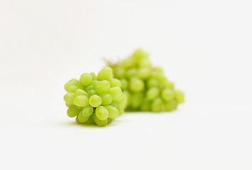 Image showing Grapes, green fruit and healthy food in studio for art and creativity for nutritionist. Fruits, wellness diet and nutrition with clean, vegan or grape snack isolated on a white background for health