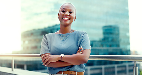 Image showing Black woman in city for business portrait while happy and arms crossed outdoor with vision and pride. Face of entrepreneur person with urban buildings and motivation for career goals as future leader