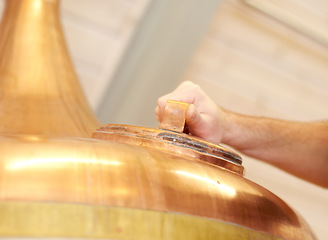 Image showing Brewery, copper tun and tank for beer, alcohol or brewing process with hatch. Man, hand and alcohol industry or distillery for storage, fermentation and manufacturing system with industrial equipment