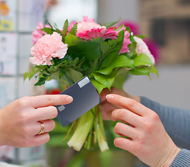 Image showing Hands, flowers and credit card for shopping in florist shop, small business or store for purchase. Plastic money, floral bouquet and customer paying, buying or payment for sale of natural plants.