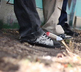 Image showing Graffiti, hip hop and shoes of friends at wall for fashion, street art and creative. Urban, relax and grunge style with sneakers of group of teenagers in park for cool, trendy and spray can