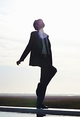 Image showing Dance, sky and freedom of man in suit and silhouette whistle with energy, dancing and happiness in nature. Dancer, happy and male person in professional clothes on mockup background for performance