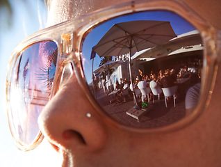 Image showing Closeup, summer and woman with sunglasses, reflection and social gathering outdoor. Zoom, female person or lady with eyewear, clear vision or outside with sun flare, sunlight or traveling with shades