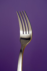 Image showing a fork against red background