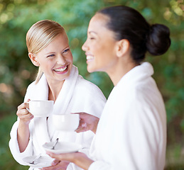 Image showing Women friends at spa with tea, happy with self care and wellness, spending quality time together at luxury resort. Beauty, stress relief and female people laughing with hot beverage on a break