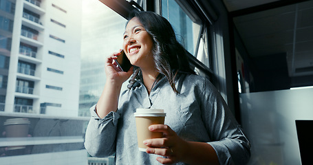 Image showing Business woman, phone call and coffee in communication, talking or conversation by window in corporate city building. Female manager or leader in discussion for strategy on smartphone at the office