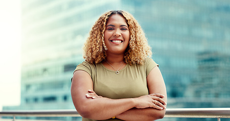 Image showing Black woman, business and city portrait while happy with arms crossed outdoor with vision and pride. Face of entrepreneur person with urban buildings and motivation for career goals for future