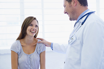 Image showing Doctor, woman patient and good news in a hospital and clinic with medical consultation. Healthcare, wellness and happiness with a young female person and medic worker with communication and support