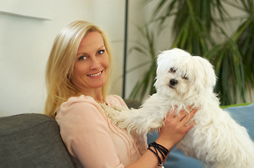 Image showing Woman, poodle dog and portrait on couch with smile, hug and care together with love, bonding or comfort in home. Pet puppy, animal and happy on sofa in living room with calm, quiet and cute in house