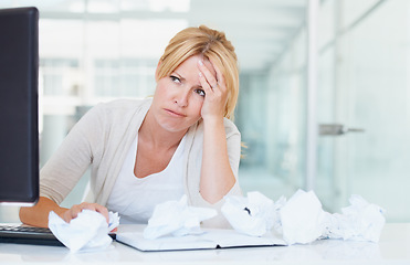 Image showing Stress, thinking and frustrated woman with crumpled papers on her desk in business office. Burnout, idea and female professional with lack of creativity, depression and fatigue, tired and brain fog.