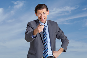 Image showing Portrait, happy business man and pointing finger to you on cloudy blue sky for vote, winner and offer. Face of corporate employee, smile and gesture forward for hand direction, emoji and decision