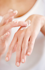 Image showing Hand cream, moisturizer and woman hands closeup with beauty and skin glow from treatment. Wellness, sunscreen and skincare lotion of a female person with manicure and cosmetics application with care