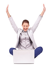 Image showing Celebration, winning and businesswoman in a studio with laptop for online sports bet success. Happy, celebrate and professional female person with a smile and computer isolated by a white background.